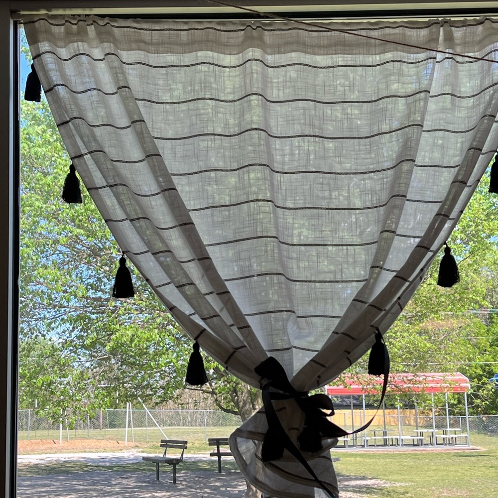 6 panel curtains. Black and white with tassels